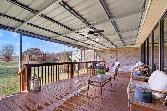 a bedroom with furniture and a chandelier