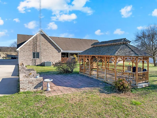 with aerial view of a house with a yard