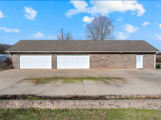 a view of a swimming pool and an outdoor seating