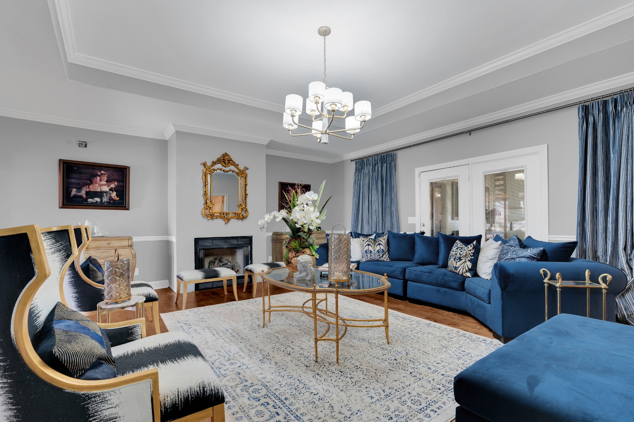 1191 Knights Church Road Decherd, TN 37324 - Photo 8 of 58 a living room with furniture a fireplace and a chandelier