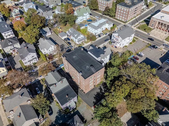 an aerial view of a house with outdoor space