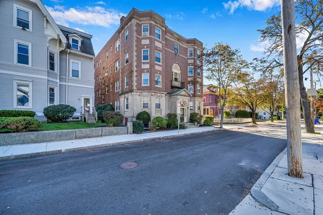 a view of a building with a street