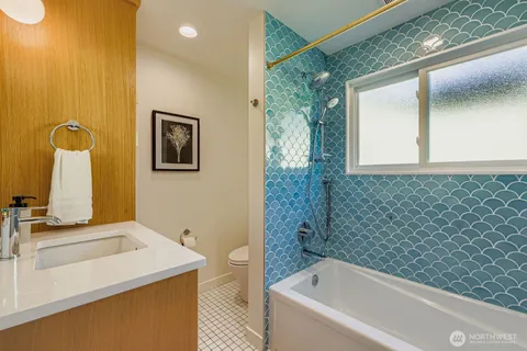 a bathroom with a sink and a bathtub
