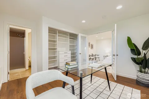 a bedroom with furniture and a window