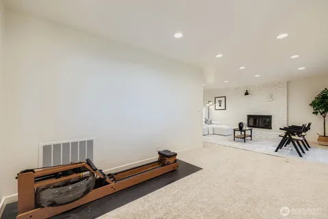 a room with gym equipment and a table