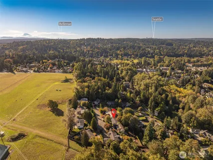 an aerial view of a house with a yard and garden