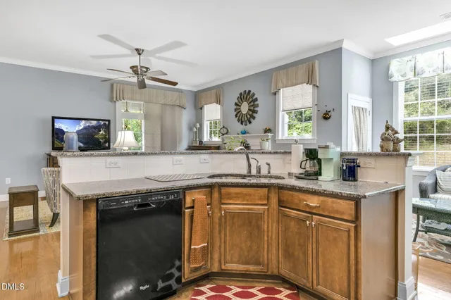 a kitchen with a sink stove and microwave