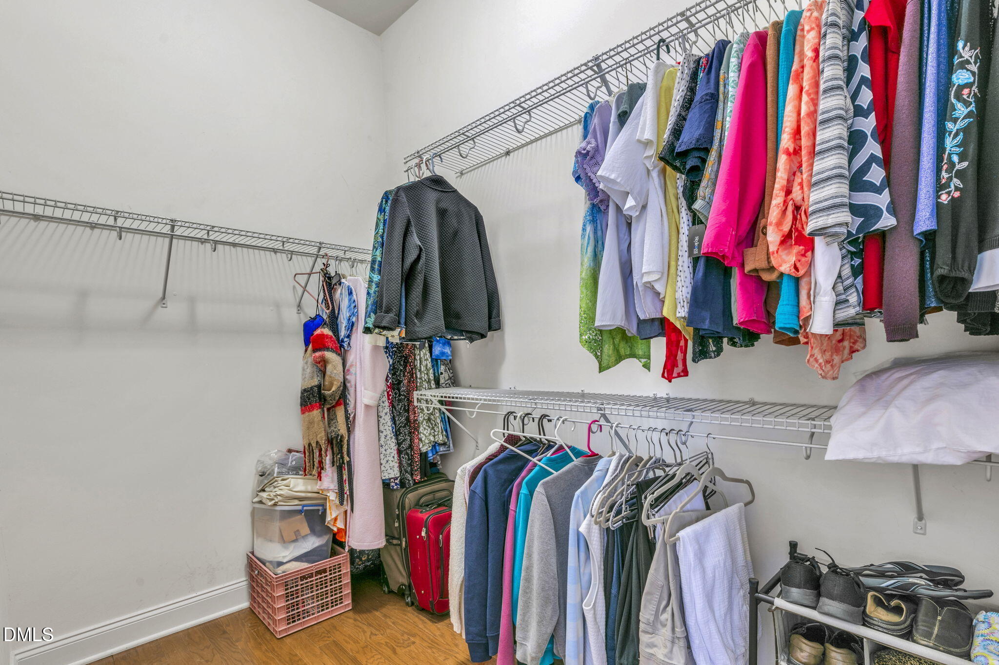 9805 Carlyle Hills Way Raleigh, NC 27560 - Photo 25 of 42 a view of walk in closet with clothes