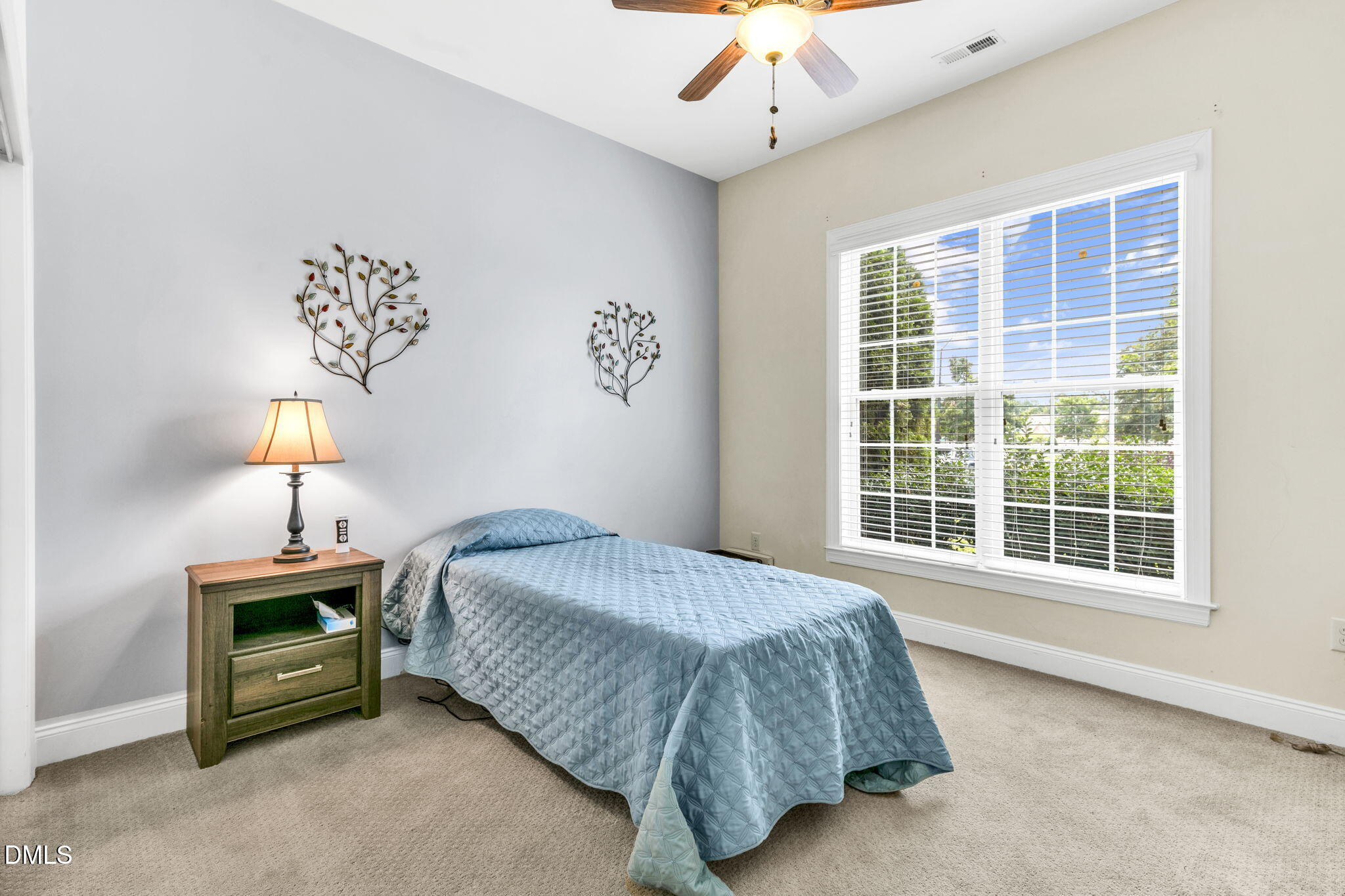 9805 Carlyle Hills Way Raleigh, NC 27560 - Photo 28 of 42 a bedroom with a bed and a window