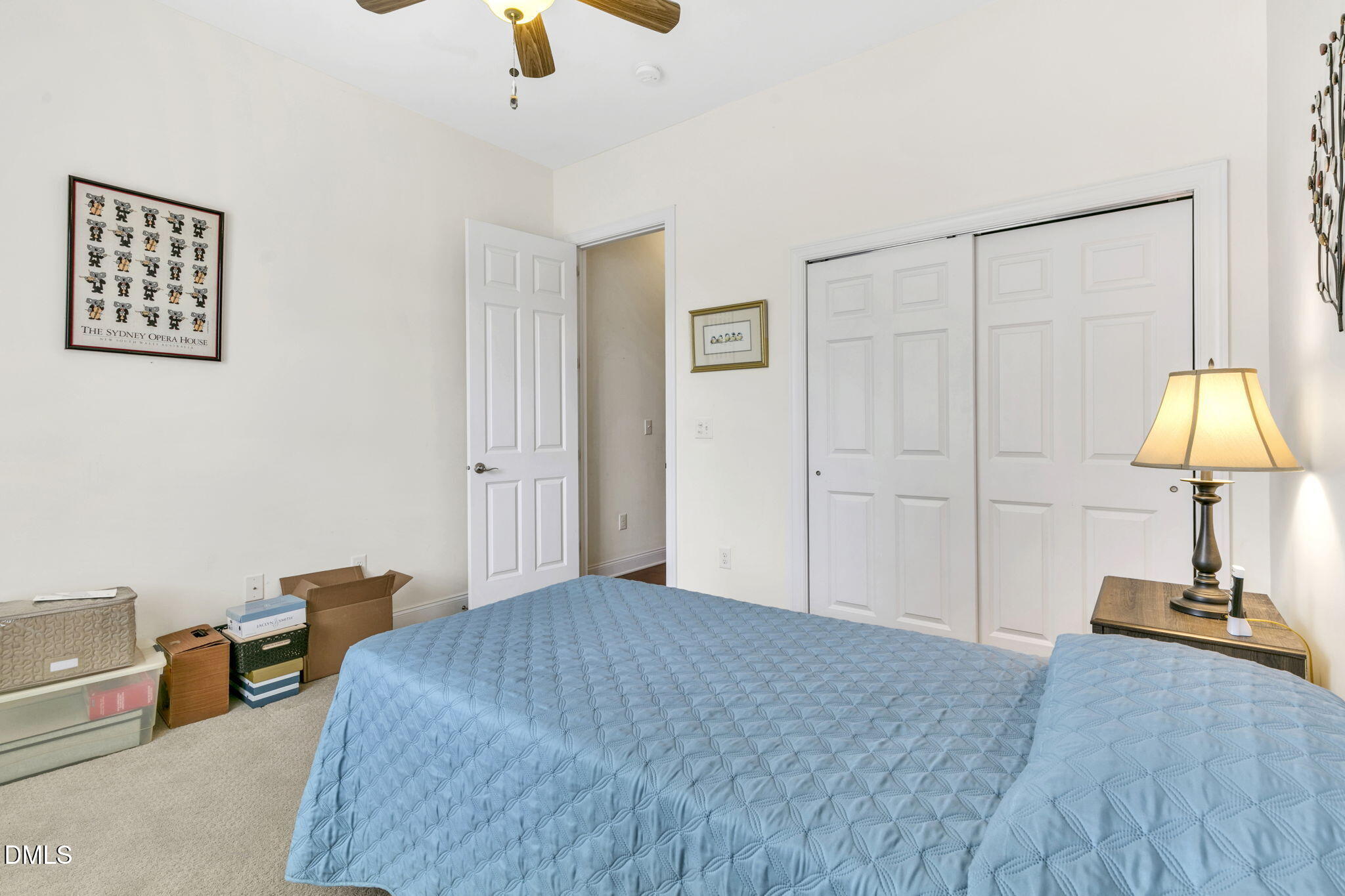 9805 Carlyle Hills Way Raleigh, NC 27560 - Photo 29 of 42 a bedroom with bed and a chandelier