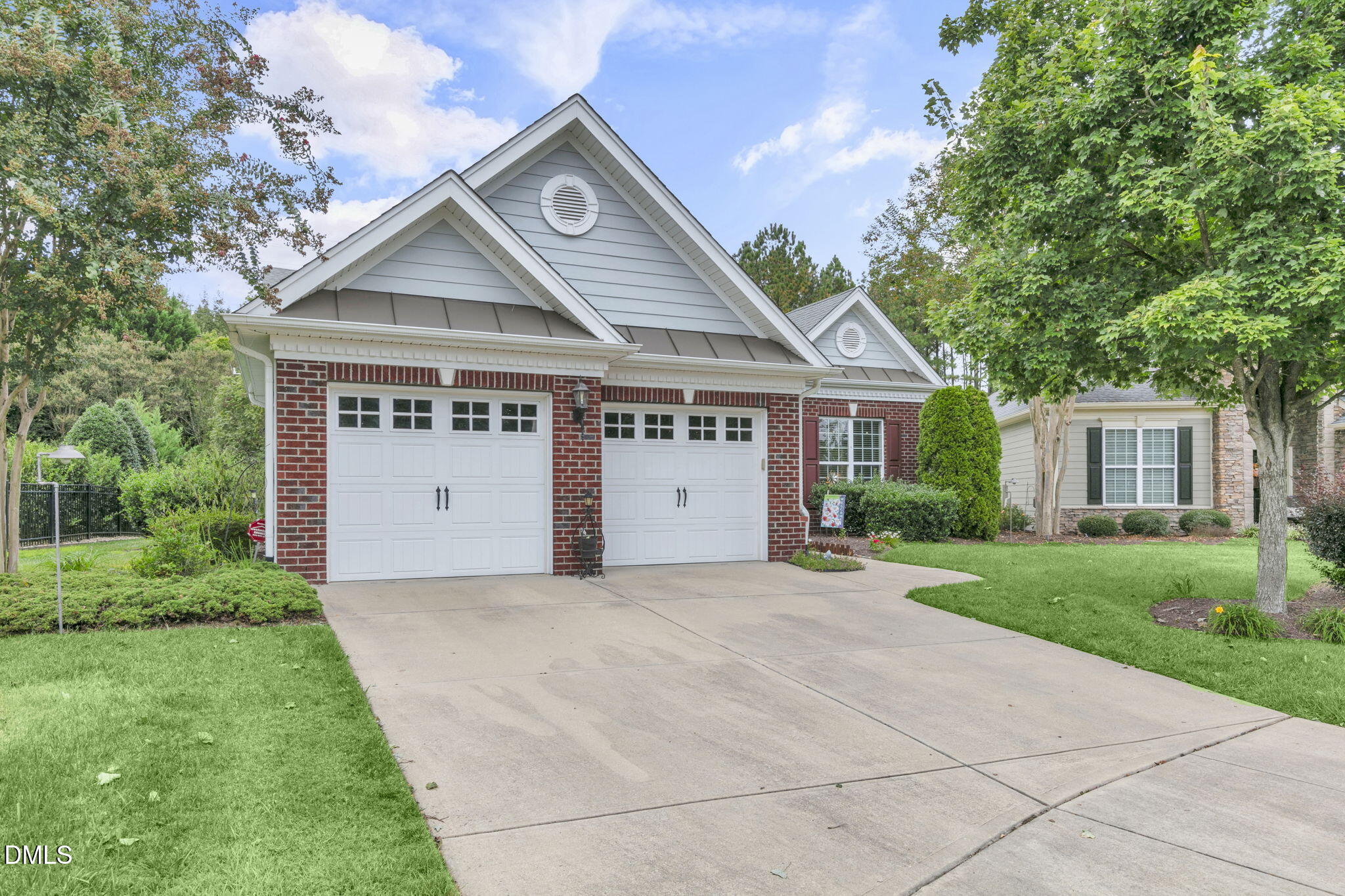 9805 Carlyle Hills Way Raleigh, NC 27560 - Photo 37 of 42 a front view of a house with a yard and garage