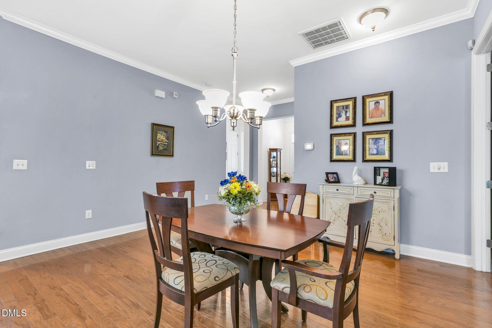 9805 Carlyle Hills Way Raleigh, NC 27560 - Photo 5 of 42 a dining room with furniture and chandelier