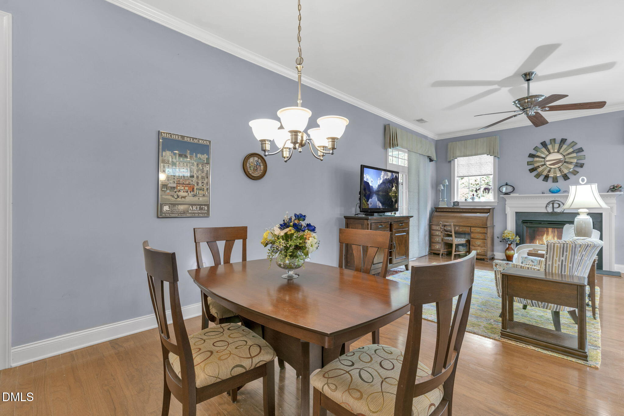 9805 Carlyle Hills Way Raleigh, NC 27560 - Photo 6 of 42 a view of a dining room with furniture and wooden floor
