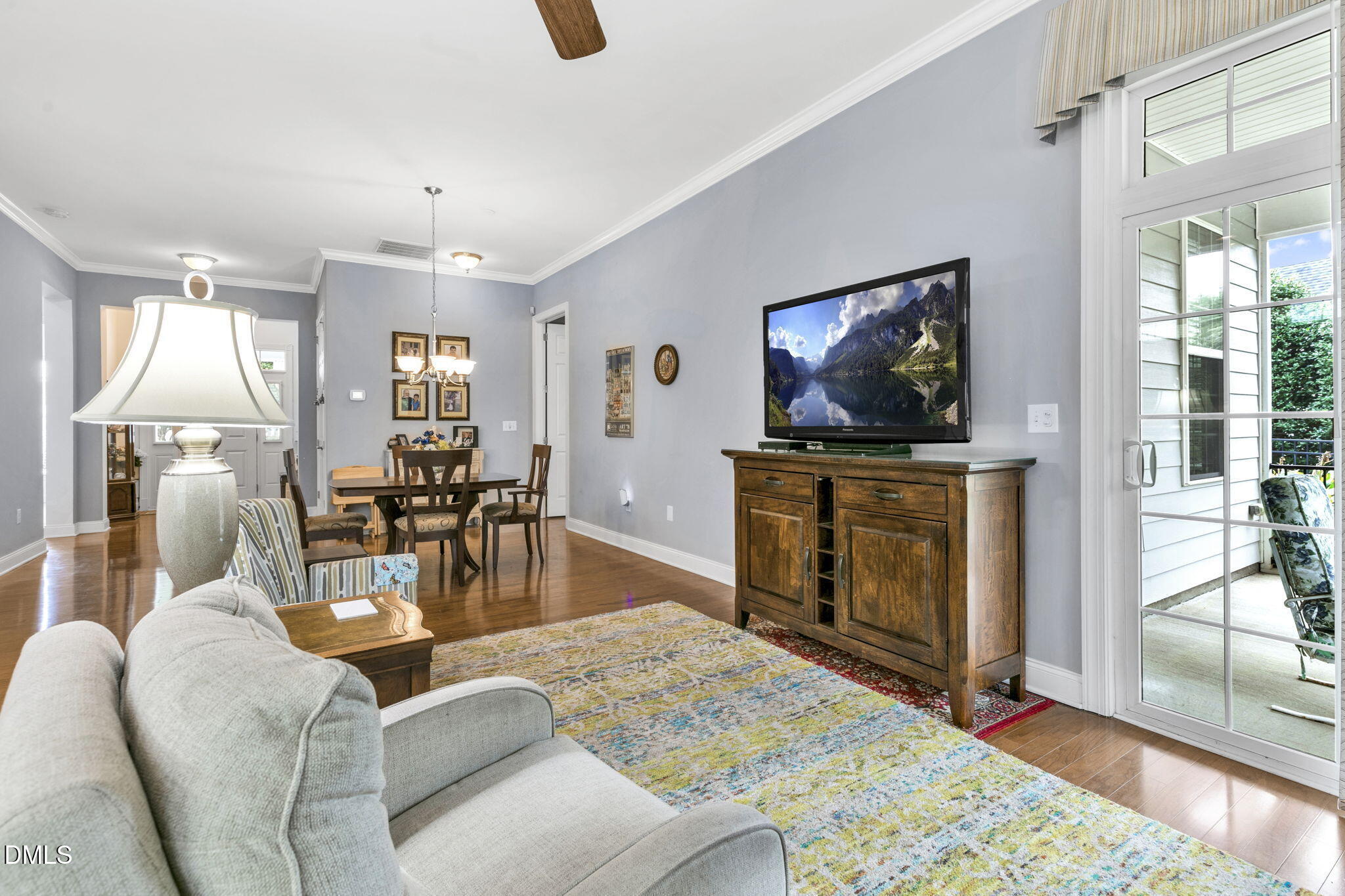 9805 Carlyle Hills Way Raleigh, NC 27560 - Photo 10 of 42 a living room with fireplace furniture and a flat screen tv