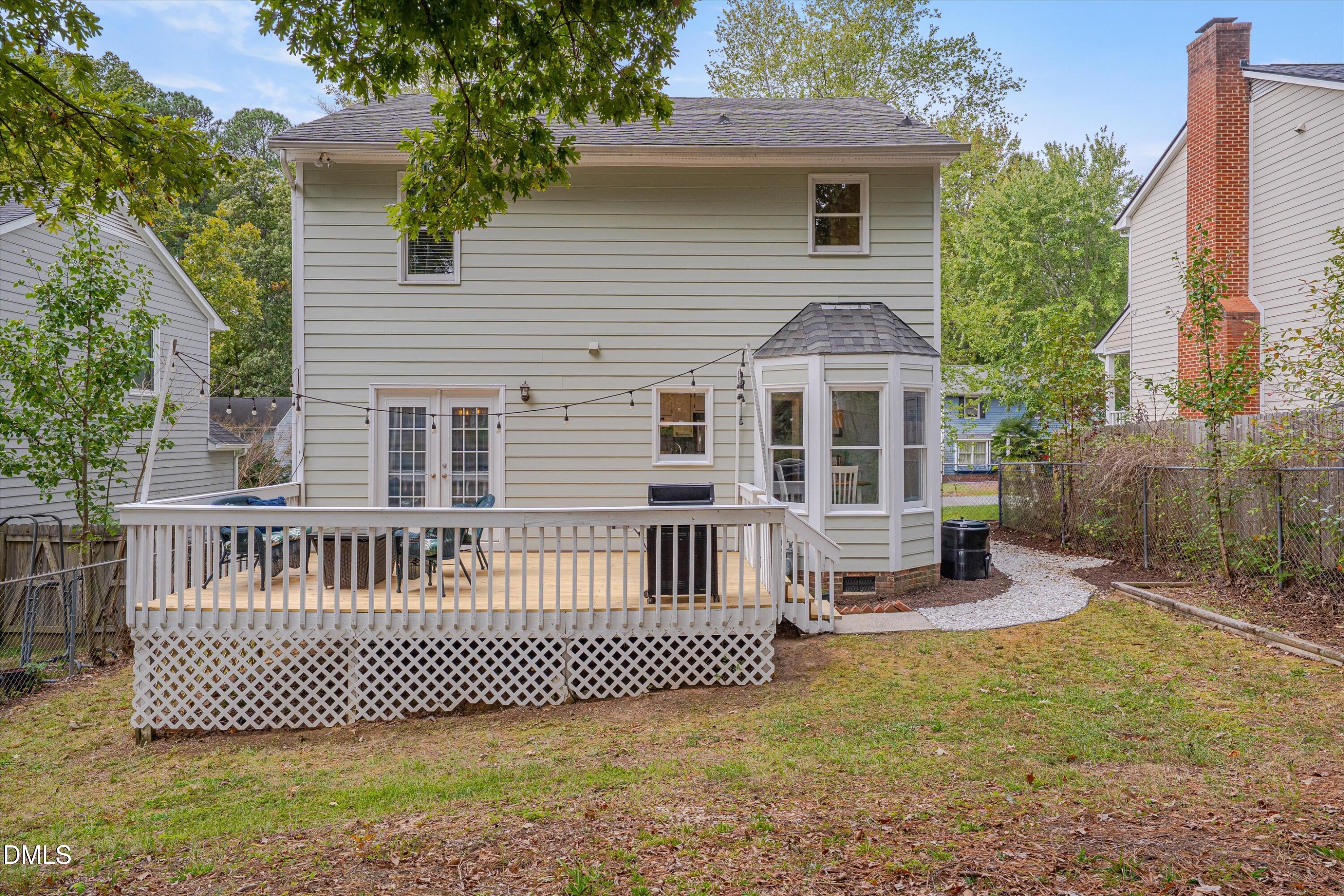 3301 Lassiter Street Durham, NC 27707 - Photo 25 of 32 a front view of a house with a garden