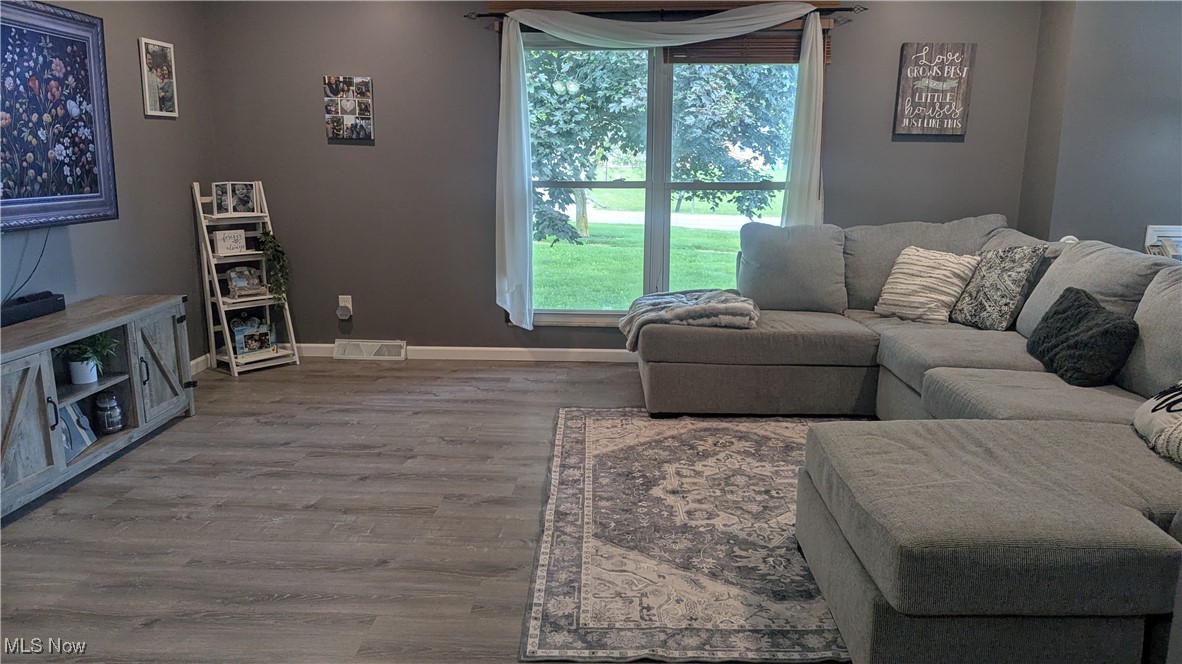290 Leatherman Road Wadsworth, OH 44281 - Photo 26 of 43 Living area featuring baseboards and wood finished floors