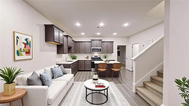 a living room with furniture and a potted plant