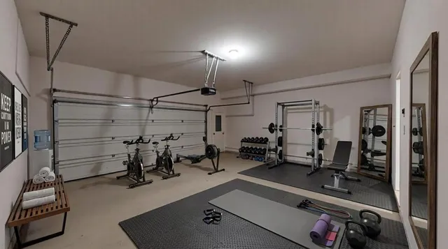 a room with gym equipment and mirror
