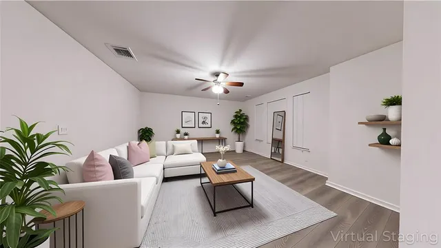 a living room with furniture and a chandelier