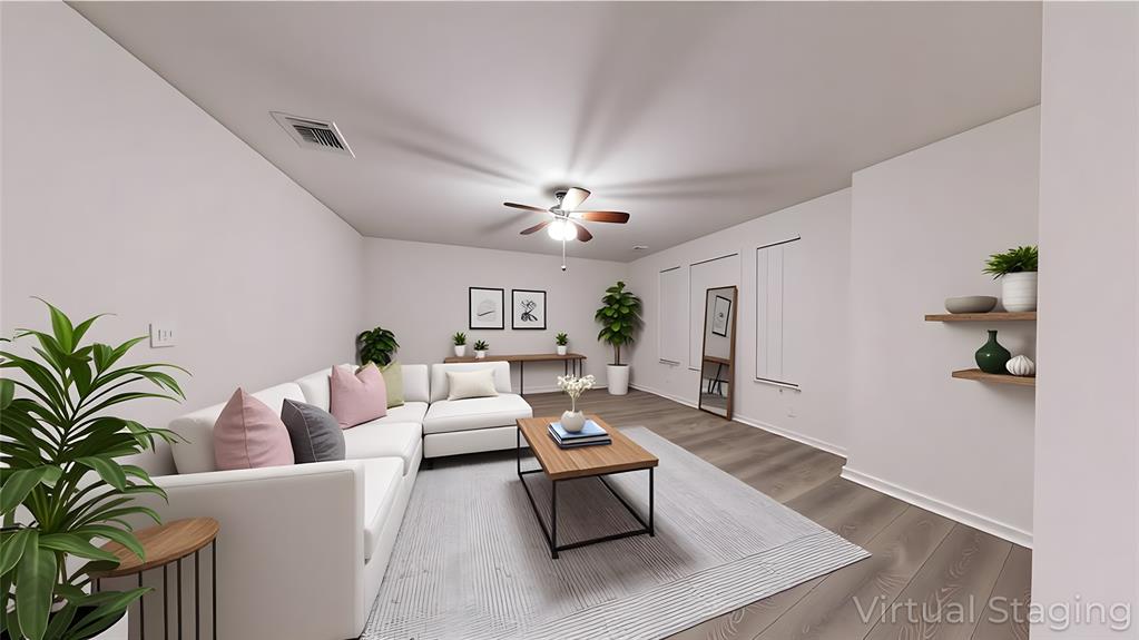 2045 Juniper Pass Way Mesquite, TX 75149 - Photo 3 of 15 a living room with furniture and a chandelier