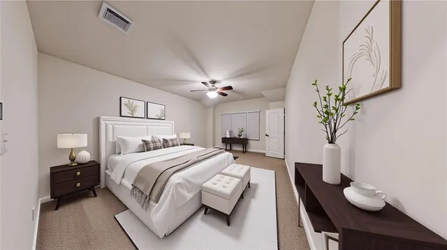 a spacious bedroom with a bed and a chandelier