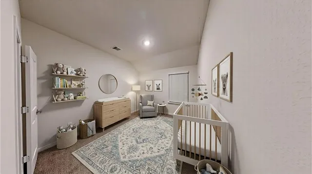 a room with furniture a rug and a window