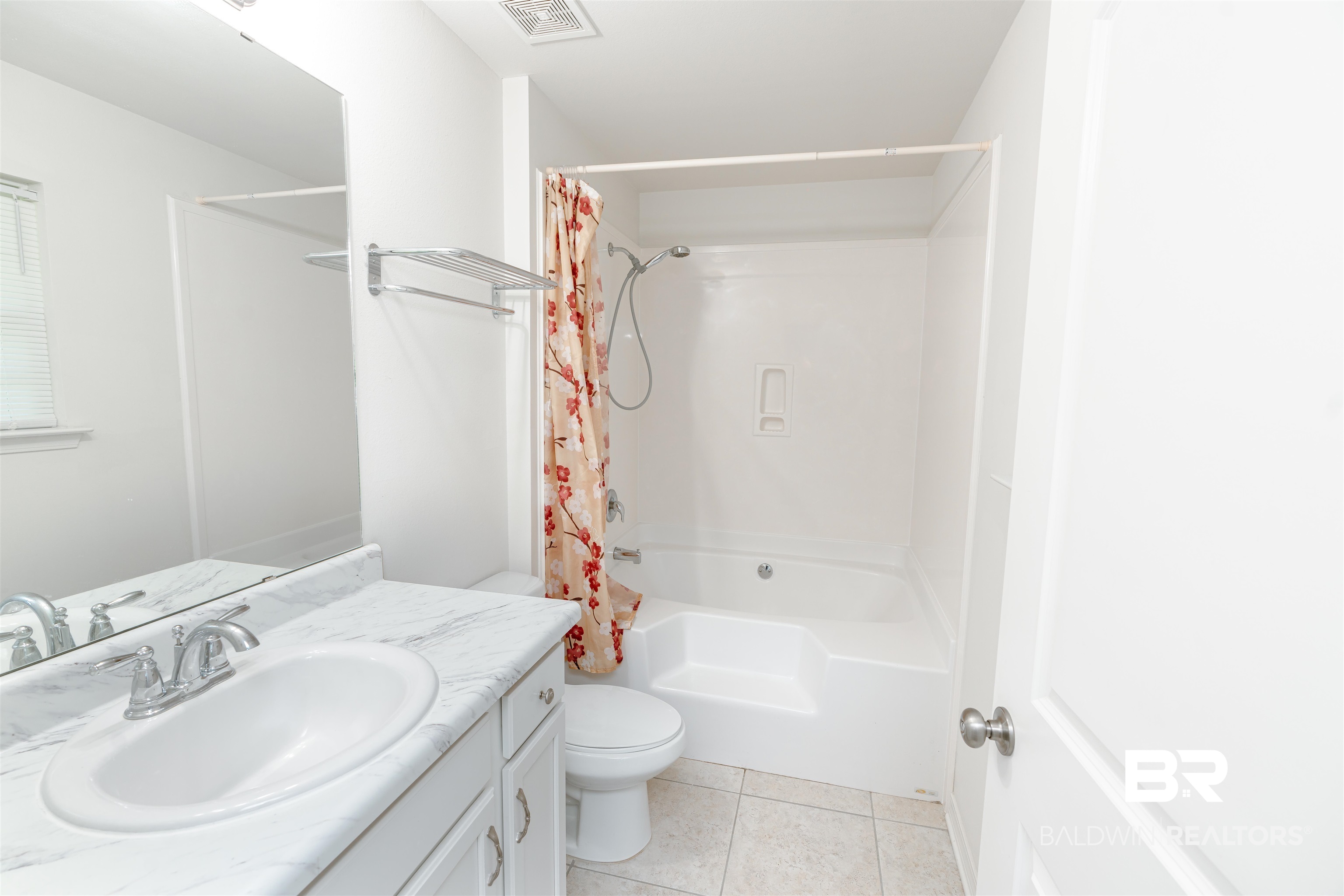 12641 Pecan Street Grand Bay, AL 36541 - Photo 15 of 23 Full bathroom featuring shower / tub combo, vanity, tile patterned flooring, and toilet
