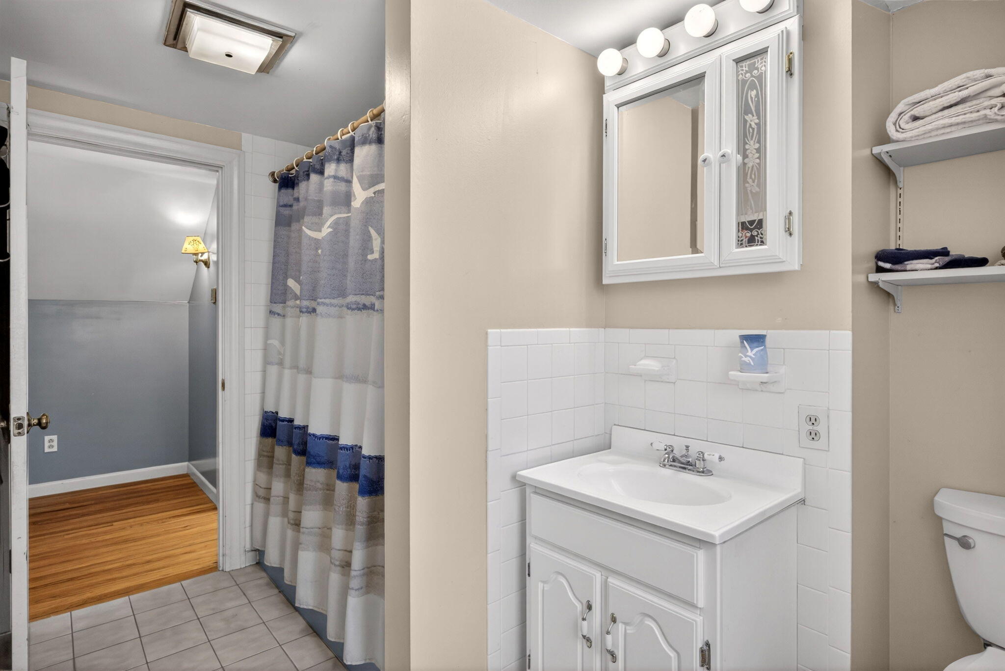 23 Nickerson Road Orleans, MA 02653 - Photo 23 of 54 a bathroom with a sink a toilet and shower