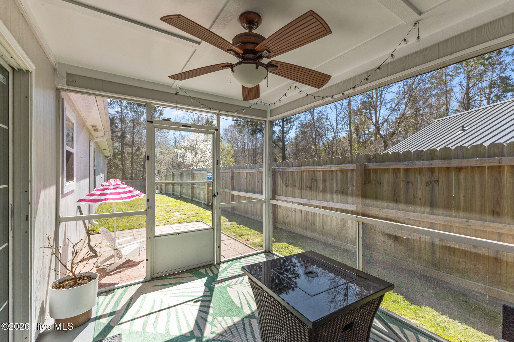229 Gray Fox Run Hubert, NC 28539 - Photo 26 of 33 Screened porch off the kitchen looking into fenced yard