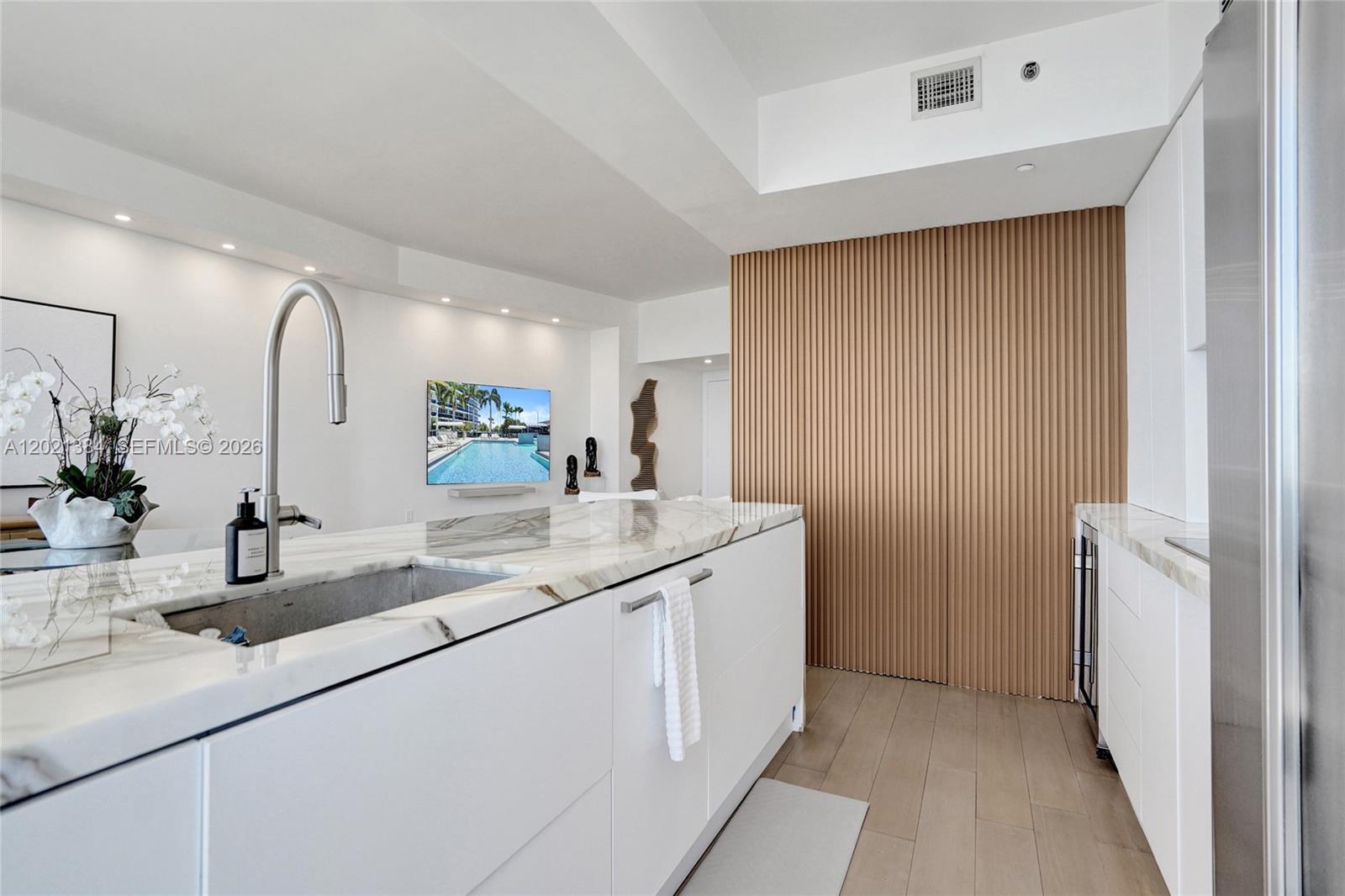 400 Alton Road, Unit PH11 Miami Beach, FL 33139 - Photo 20 of 49 a bathroom with a double vanity sink and a mirror