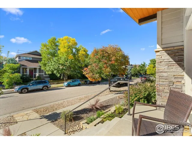 a view of a backyard with sitting area