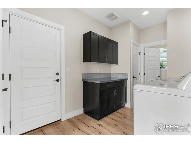 a kitchen with stainless steel appliances granite countertop a stove and a microwave