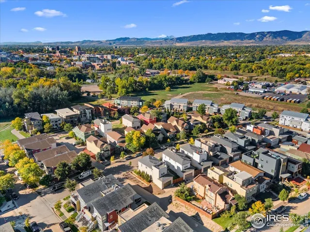 an aerial view of residential houses with outdoor space