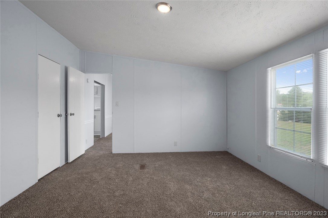 67 Apache Drive Parkton, NC 28371 - Photo 14 of 18 a view of an empty room with a window