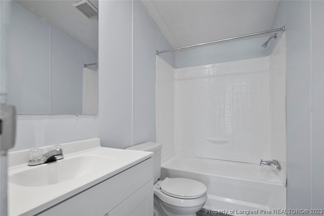 67 Apache Drive Parkton, NC 28371 - Photo 16 of 18 a bathroom with a sink toilet and shower