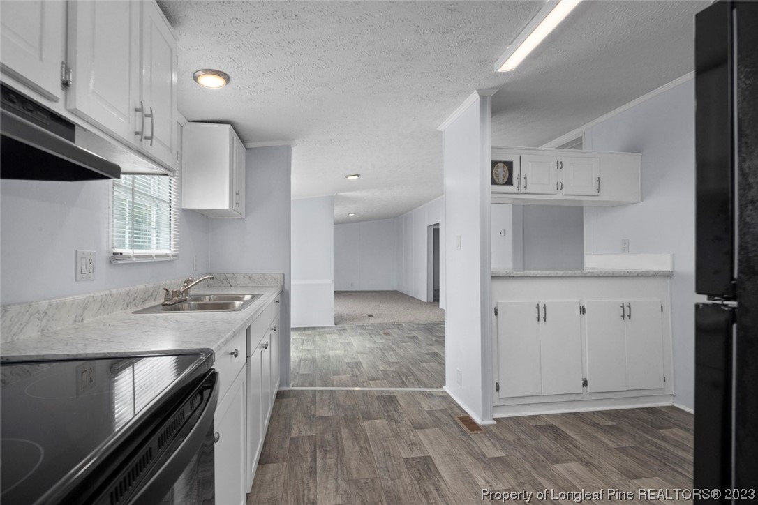 67 Apache Drive Parkton, NC 28371 - Photo 6 of 18 a view of a kitchen with electric appliances