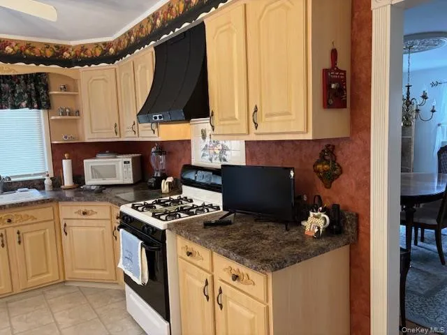 a kitchen with a stove and a microwave