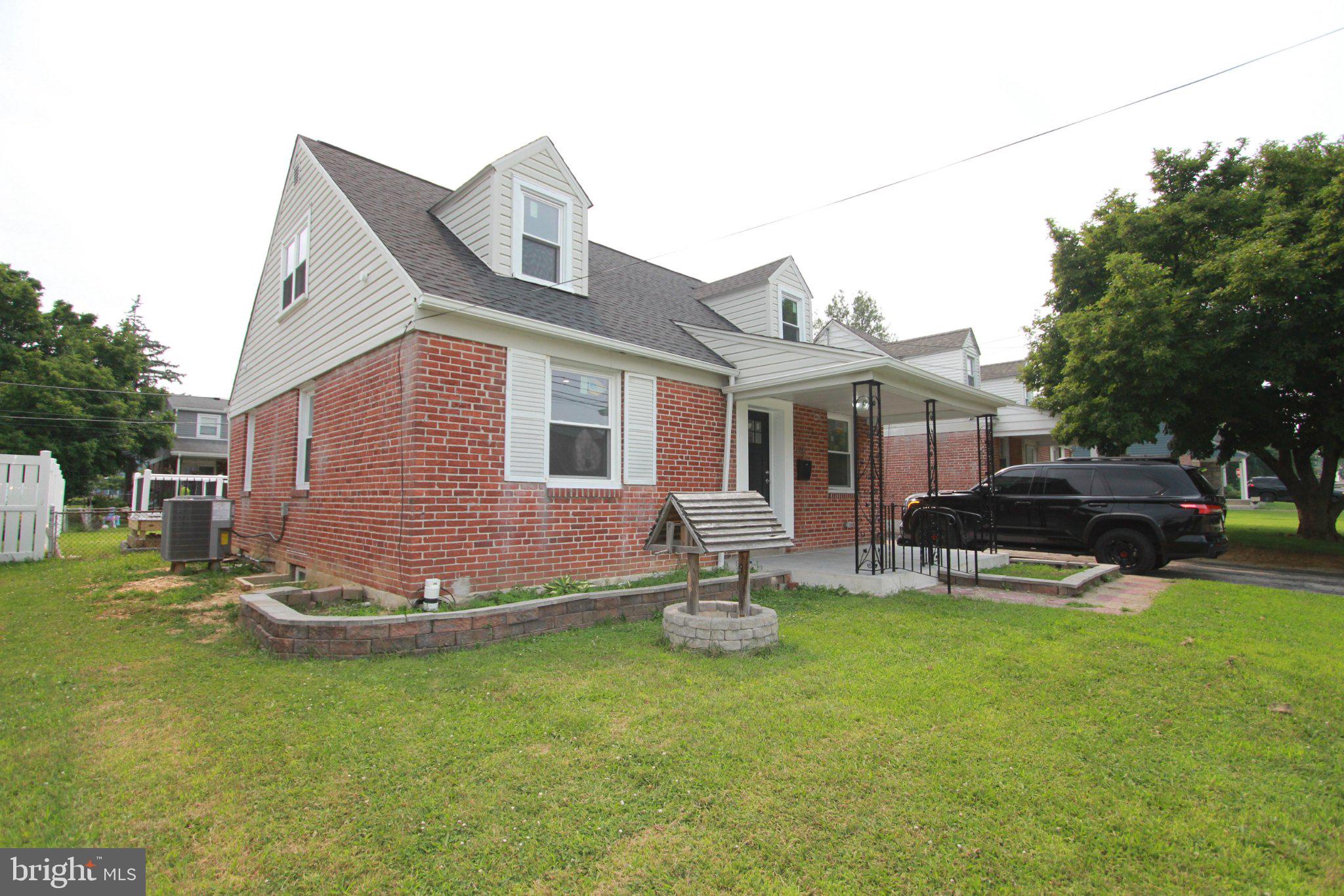 528 Crum Lynne Road Ridley Park, PA 19078 - Photo 3 of 51 Charming brick home with lush greenery.