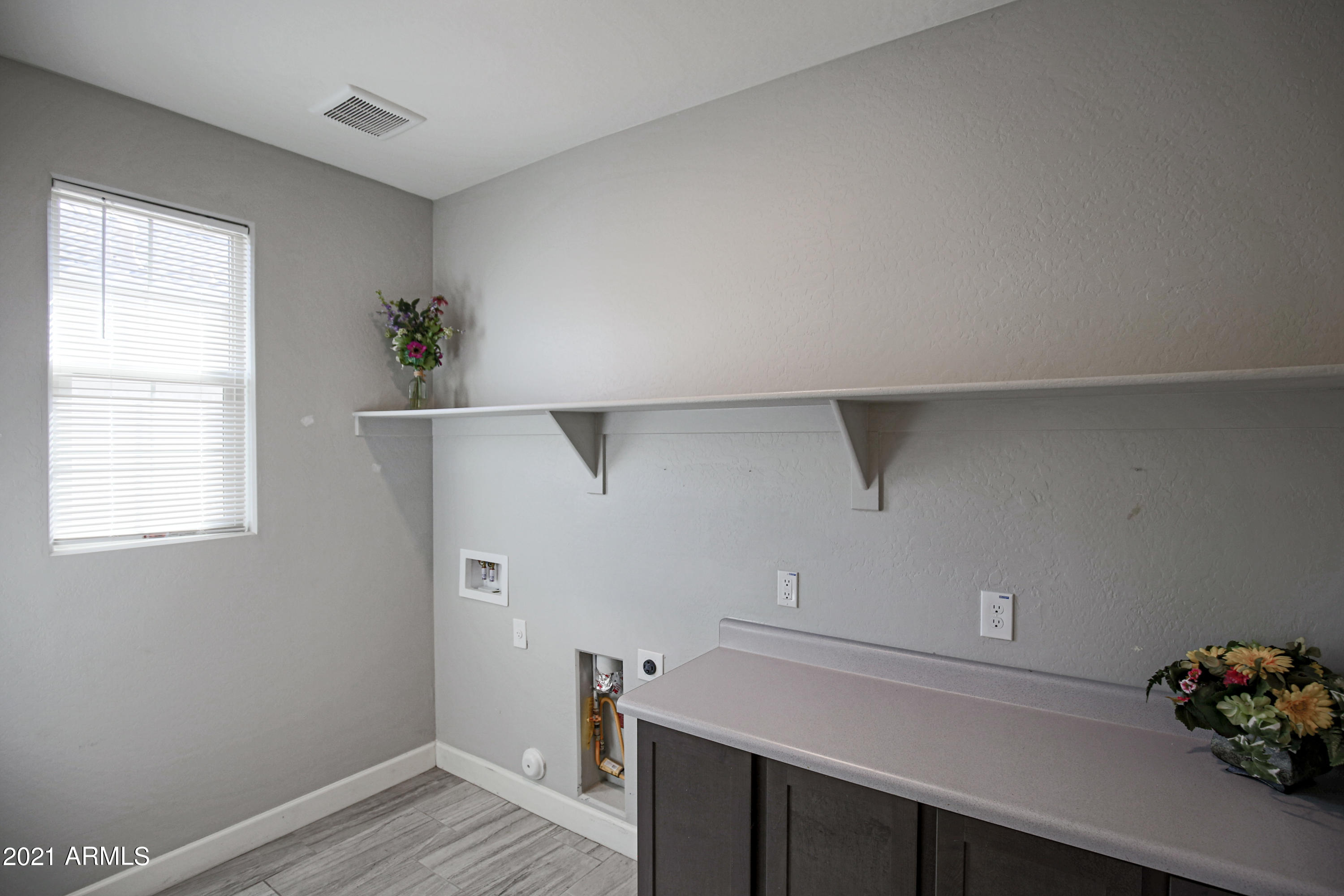 18325 West Raven Road Goodyear, AZ 85338 - Photo 21 of 59 Large Laundry with storage!