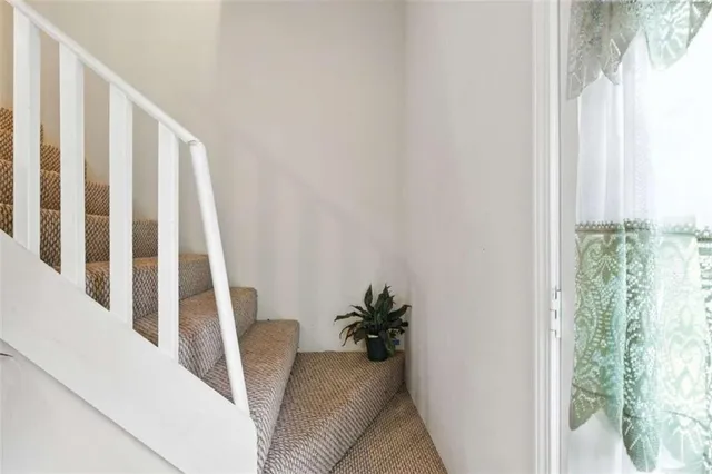 a view of entryway with wooden floor and a potted plant