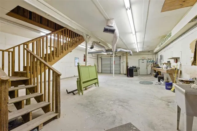 a view of a livingroom with stairs and furniture