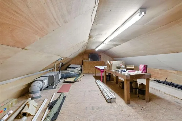 a living room with lots of furniture and a chandelier