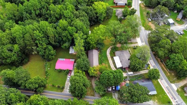 an aerial view of residential house with outdoor space and swimming pool