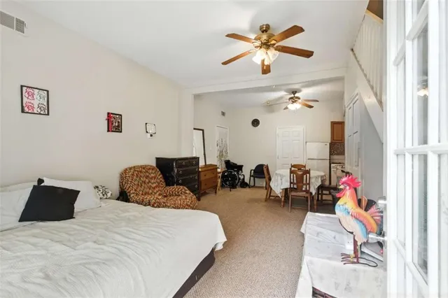 a bedroom with furniture and a chandelier