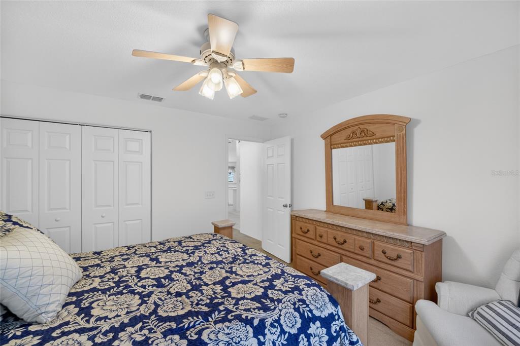 6032 Southwest 103rd Loop Ocala, FL 34476 - Photo 15 of 28 a bedroom with a bed and a television