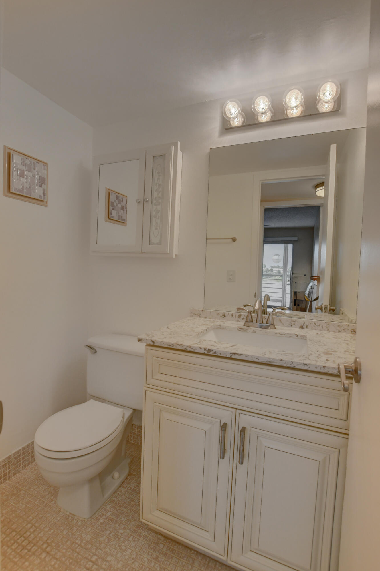3060 Exeter Boca Raton, FL 33434 - Photo 15 of 49 a bathroom with a granite countertop toilet sink and mirror