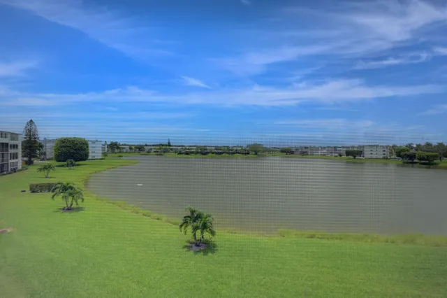 a view of a lake with a yard