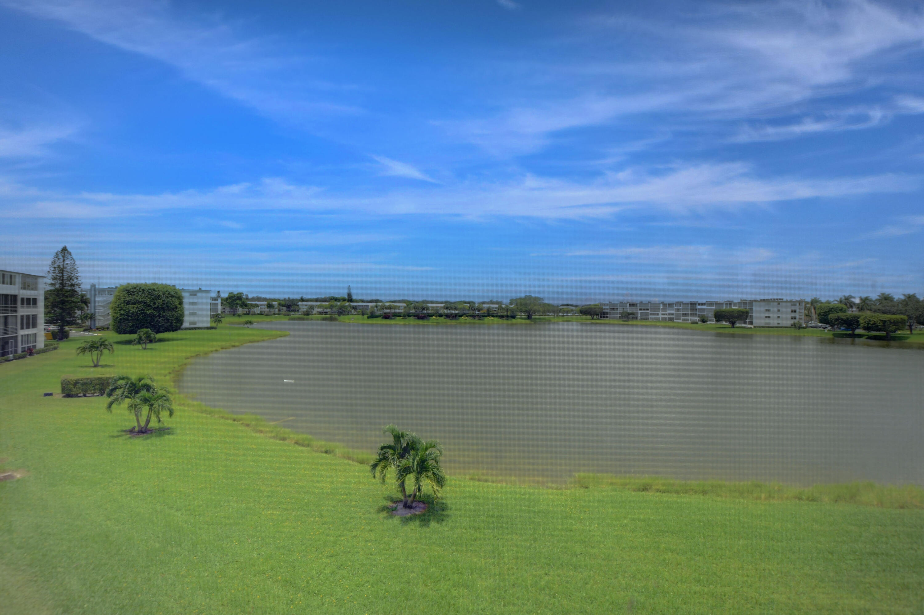 3060 Exeter Boca Raton, FL 33434 - Photo 21 of 49 a view of a lake with a yard