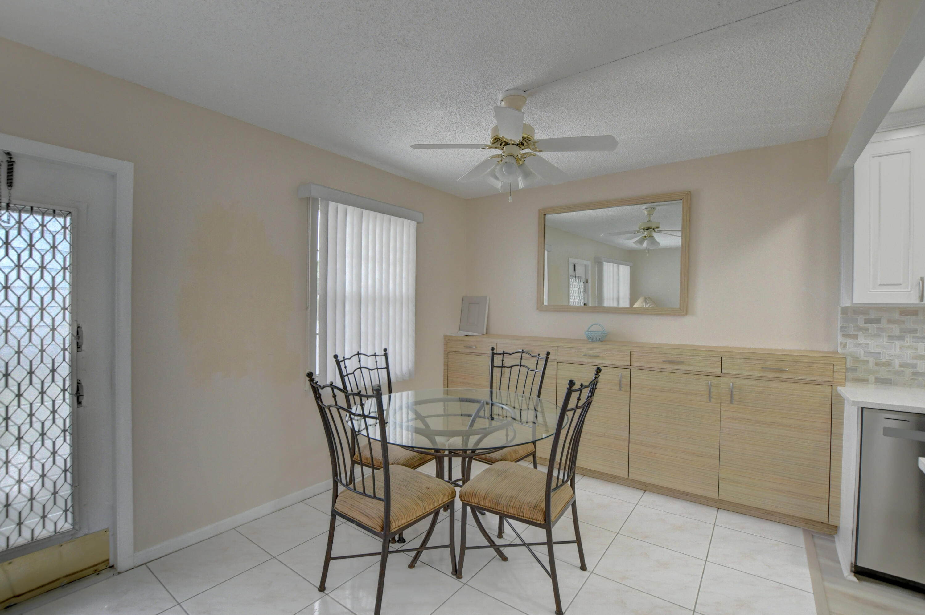 3060 Exeter Boca Raton, FL 33434 - Photo 7 of 49 a view of a dining room with furniture and window