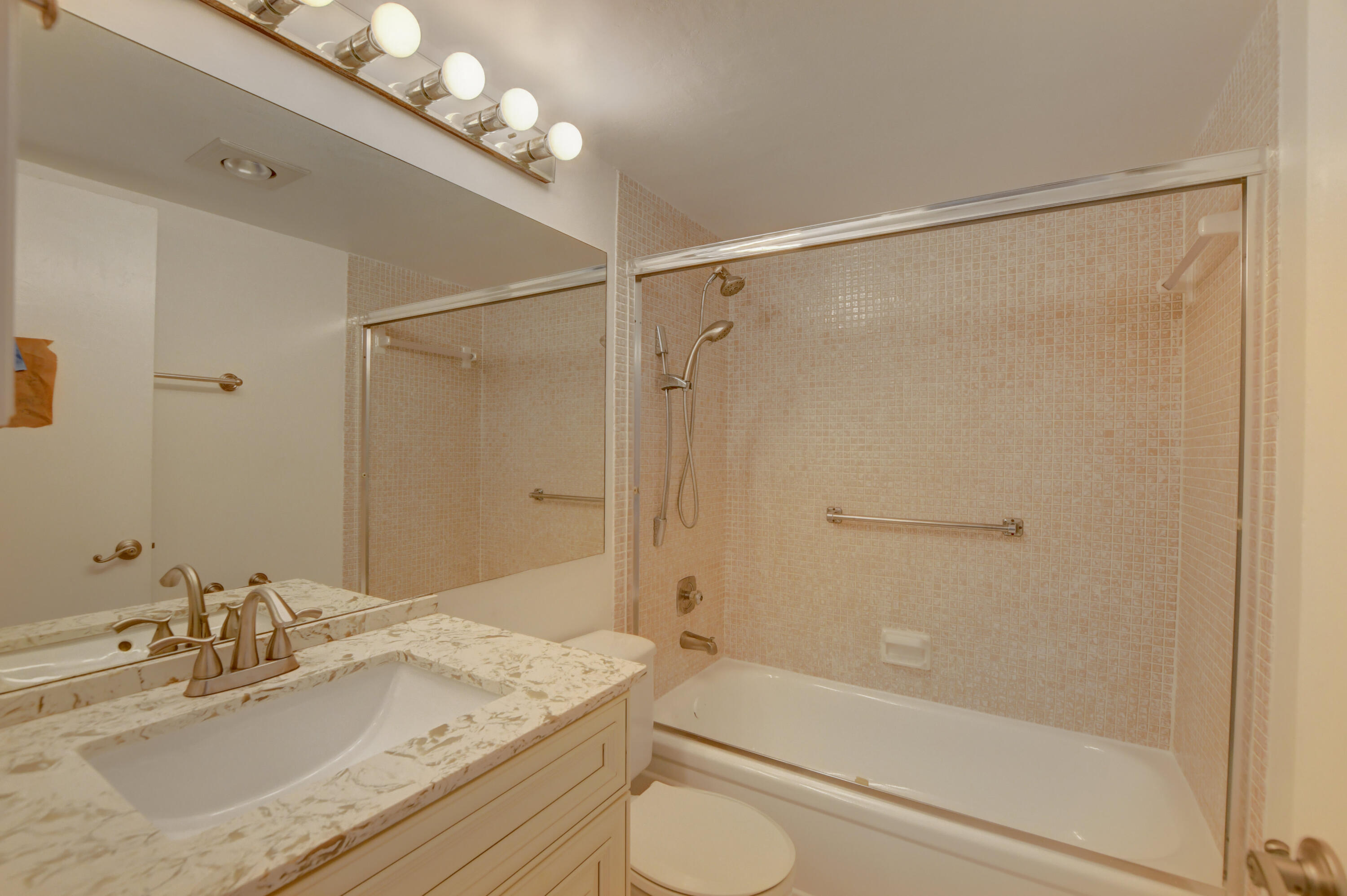 3060 Exeter Boca Raton, FL 33434 - Photo 10 of 49 a bathroom with a granite countertop sink toilet and shower